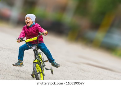 Emotional Boy Learning To Ride A Bike