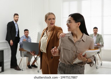 Emotional Colleagues Fighting In Office. Workplace Conflict