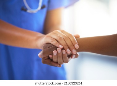 Emotional Comfort Stored In Fingerprints. Shot Of An Unrecognizable Doctor Holding Hands With Her Patient During A Consultation.