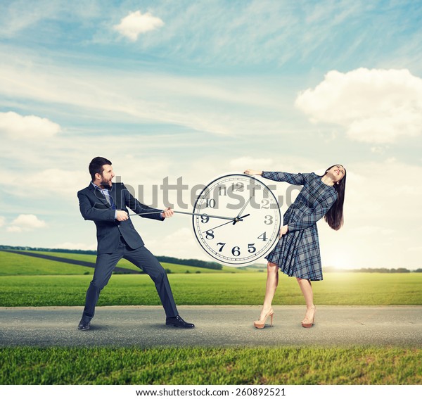 emotional couple with clock\
at outdoor