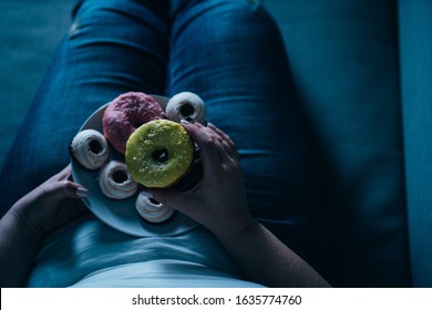 Emotional Eating, Mental Disorder, Depression, Loneliness, Stress. Lonely Woman Eating Sweets And Watching Tv Late In The Night. Nerve Food