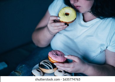 Emotional Eating, Mental Disorder, Depression, Loneliness, Stress. Lonely Woman Eating Sweets And Watching Tv Late In The Night. Nerve Food