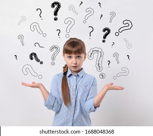 Emotional Girl With Drawings Of Question Marks On White Background