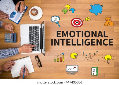 EMOTIONAL INTELLIGENCE Business Team Hands At Work With Financial Reports And A Laptop