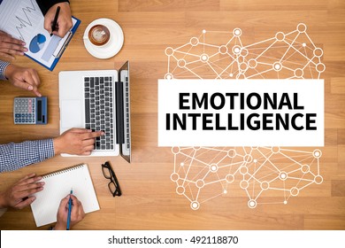 EMOTIONAL INTELLIGENCE Business Team Hands At Work With Financial Reports And A Laptop