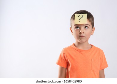 Emotional Little Boy With Question Mark On White Background