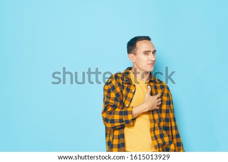 emotional male yellow plaid shirt studio lifestyle