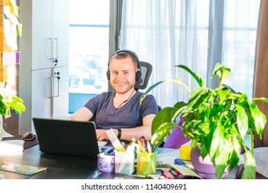 Emotional Man In Headphones Looking At Computer Screen, Gestures And Participating In Online Meeting, Conference With Business Partners, Remote Job Interview, Learning Languages, Consulting Clients