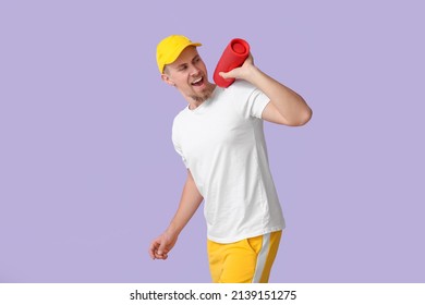 Emotional Man With Wireless Portable Speaker On Violet Background