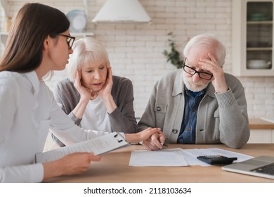 Emotional mental support. Financial adviser consulting senior elderly grandparents couple showing debts, bunkruptcy, negative test results, mortgage, divorce certificate contract pension at home - Powered by Shutterstock