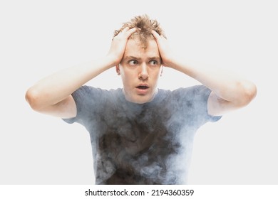 Emotional pain. Young man in deep emotional shock isolated over white background with clouds of smoke. Concept of mental health, art, human emotions, challenges, ad - Shutterstock ID 2194360359