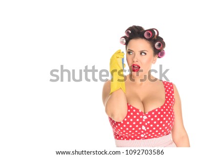 emotional plus size woman in rubber gloves talking with sponge like with phone isolated on white