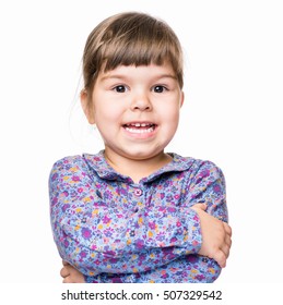 Emotional Portrait Of A 3 Years Old Girl, Smiling. Cute Caucasian Baby Isolated On White Background. Beautiful Preschool Child Posing In Studio. Healthy Carefree Kid Playing Indoors.