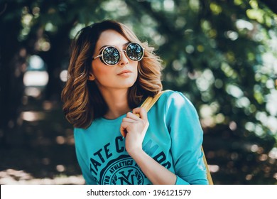 Emotional portrait of Fashion stylish portrait of pretty young hipster blonde woman,going crazy,elegant black hat,soft colors,cool crazy  girl.Red urban wall background.surprised girl close up, park - Powered by Shutterstock