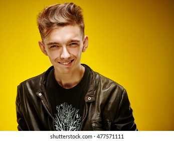 Emotional Portrait Of A Teenager On A Yellow Background