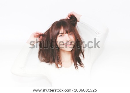 Similar – Young cheerful woman with a gift over her head