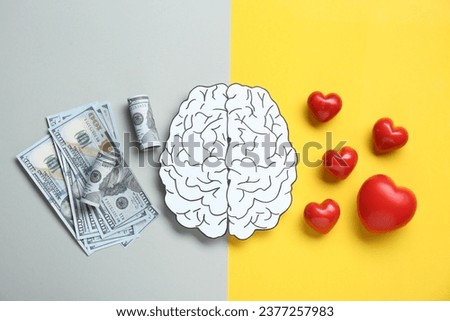 Emotional and rational. Paper human brain, dollar banknotes and red hearts on color background, flat lay