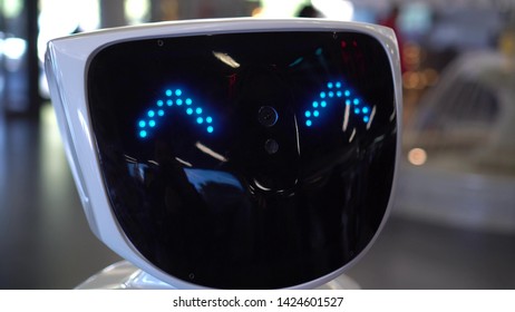 Emotional Robot. Face of Robotics. The Human Robot's face expresses emotions - happiness, joy, smile. Modern Robotic Technologies