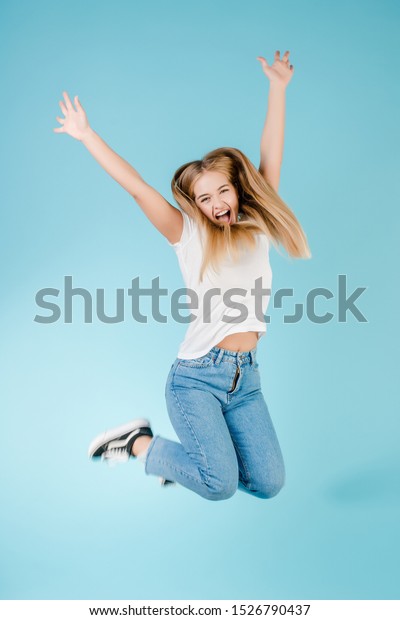 Emotional Smiling Happy Blonde Girl Jumping Stock Photo (Edit Now ...
