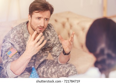 Emotional soldier communicating with psychotherapist - Powered by Shutterstock