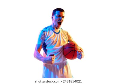 Emotional sportsman, basketball player shouting holding ball and clenched fist against white studio background in neon light. Concept of professional sport, energy, strength and power, win, tournament - Powered by Shutterstock