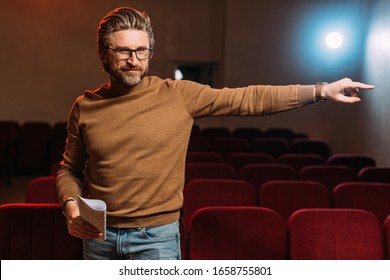 Emotional Stage Director With Scenario Pointing On Rehearse In Theater