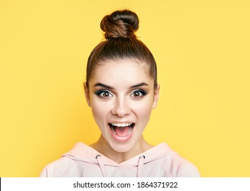 Emotional Suprised Woman Face Close Up Portrait On Yellow Background. Emotions Concept, Wow Concept