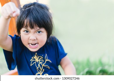 Emotional Tantrum And Angry Little Girl In The Car.Mad Kid Got Upset And Sad And She Has A Negative Attitude.Depressed Little Girl Complaining.Attention Deficit Hyperactivity Disorder (ADHD) Concept. 