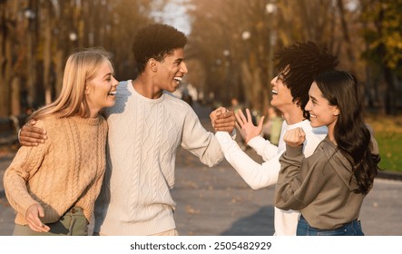 Emotional teen mixed race couple greeting each other at public park - Powered by Shutterstock