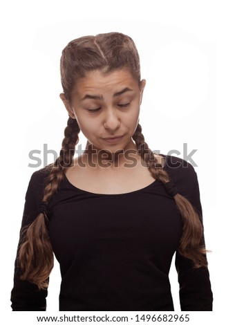 Emotional teenager girl in long hair braid hairstyle posing on a white background