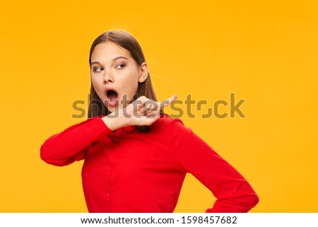 Emotional woman red shirt hand gesturing