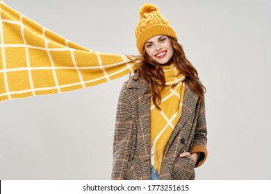 Emotional Woman With A Scarf Around Her Neck And A Jacket With A Hat On Her Head