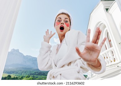 emotional woman in a white coat holds her hand in front of her