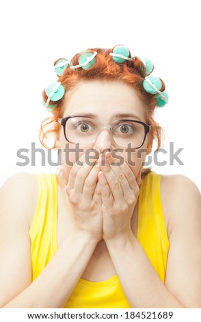 emotional young woman in curlers isolated on white background