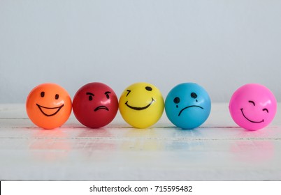 Emotions balls background, Happy Smiley faces ball in yellow , orange and pink. Sadness ball in blue and madness ball in red. Self made hand draw balls. - Shutterstock ID 715595482