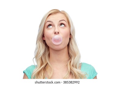 Emotions, Expressions And People Concept - Happy Young Woman Or Teenage Girl Chewing Gum