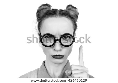 Emotions. Funny nerdy redhead girl. Beautiful girl in glasses.Black and white photo