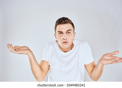 Emotions Man White Tshirt Shrugs His Stock Photo (Edit Now) 1049485241