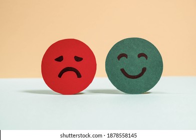 Emotions: positive, neutral and negative (red, yellow and green different moods). Rating smile for customer opinion. Paper cut. Mental health assessment, feedback rating and review concept.