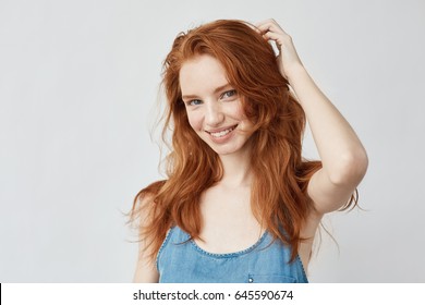 Emotive Sincere Happy Girl With Red Hair Smiling.