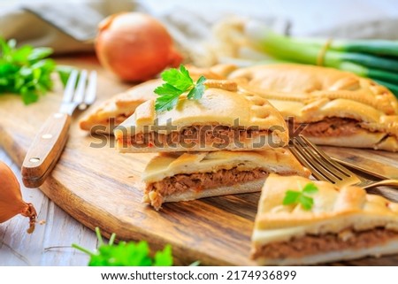 Empanada Gallega - traditional pie stuffed with tuna, Galician and Spanish cuisine. Tart with tuna and vegetables.
