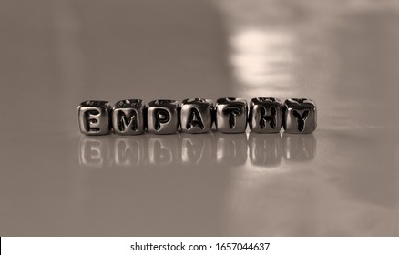 Empathy -  word from metal blocks  - concept sepia tone photo on shine background
