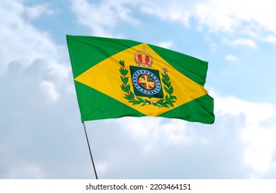 Empire Of Brazil Flag In Front Of Blue Sky - Realistic 3D Rendering