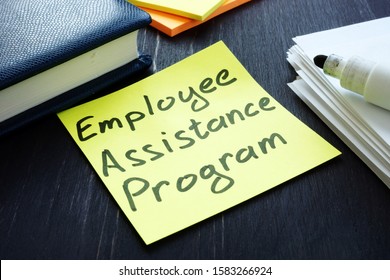 Employee assistance program EAP sign and pile of papers.