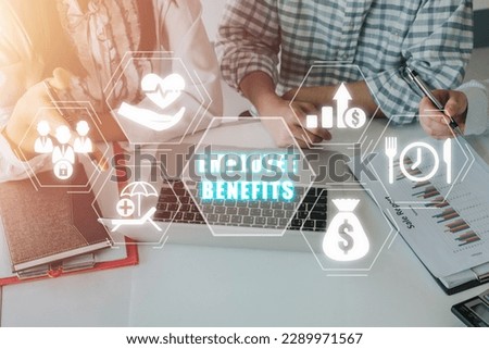 Employee Benefits Career Concept, Business team working on laptop computer and analyzing finance data on office desk with employee benefit icon on virtual screen.