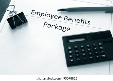 Employee Benefits Package With Calculator And Pen