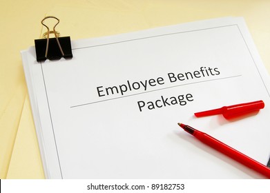 An Employee Benefits Package And Red Pen