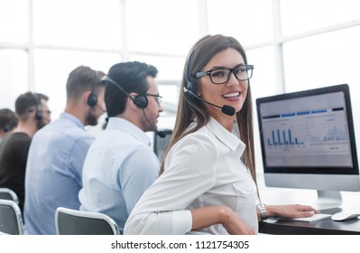 employee of the business center using the computers to analyze the data - Powered by Shutterstock