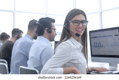 employee of the business center using the computers to analyze the data - Powered by Shutterstock