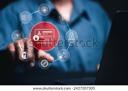 Employee confidentiality concept.  Managing corporate files and employee information. Person use laptop with confidential word and icon on virtual screen to access documents data and cyber security.